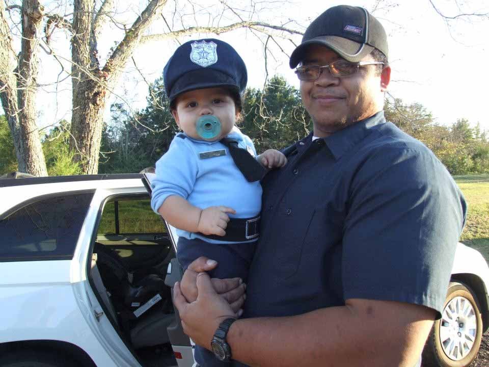 Officer Alyzander and and his father Patrick Hamilton. Patrick Hamilton is a real Troy Police officer.