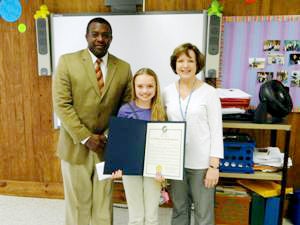 Danielle Daniel has been named the winner of Troy’s Mayor for a Day contest. Pictured are Charles Henderson Middle School Principal Aaron Brown III, Daniel, CHMS English teacher Debbie Tarbox.