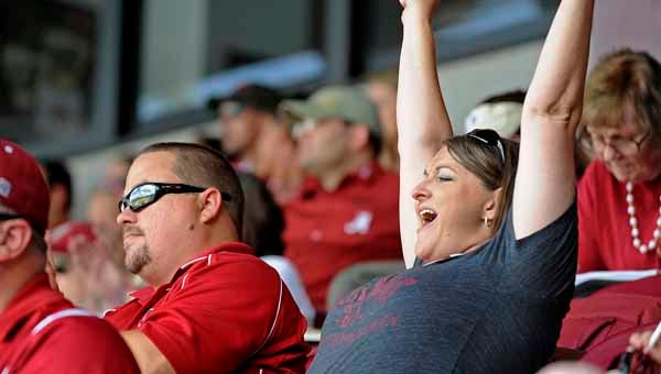 Brian and Ty Ross cheer during a NCAA baseball game between Troy and Alabama in Tallahassee, Fla.