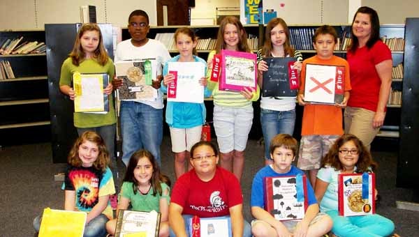 Banks School Alabama History Scrapbook winners are pictured on top from left to right are Caitlin Calhoun, Anthony Carter, Destiny Price, Emily Hughes, Anna Price, Justin Brooks and teacher Brandi DeSandro. On the bottom row from left to right are Carsyn Smith, Emma Earles, Joshlyn Johnson, Trevor Hueston and Belle Bullard.