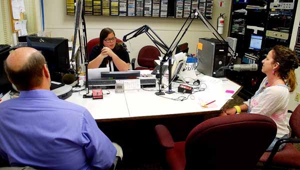 Dr. John Miller and Angel Tillery are interviewed by Katsiree Suwaratana with WTBF during the radiothon to benefit the Troy Miracle League Playground project Thursday afternoon. 