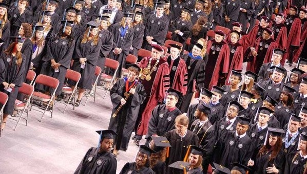 The largest class ever to graduate from Troy University filled the Trojan Arena on Friday morning, made up of students receiving associate degrees, bachelor degrees and doctorates. Gov. Robert Bentley was the keynote speaker for the spring 2013 commencement service for the graduates coming from 27 states and 14 countries. More than 900 students graduated this term and about 610 participated in the Friday ceremony. Bentley also received an honorary doctorate from the university.