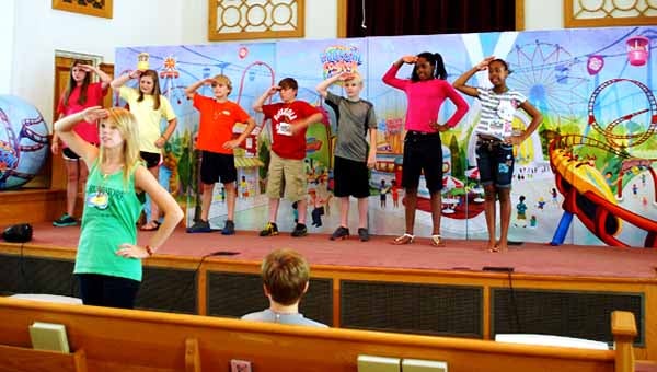 Children in grade 3-5 at Southside Baptist Church in Troy practice their songs for the VBS ending show.