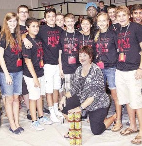 Kim May, director of the Pike County Salvation Army Service Center in Troy, is pictured with Pensacola participants in the Church of Jesus Christ of Latter-day Saints Annual Multi-Stake Youth Conference held at Troy University this weekend. 