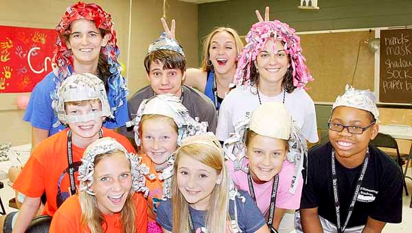 The 2013 Creative Drama Camp is underway at Troy University. Campers were busy Wednesday making wigs from newspaper. Pictured seated from left, Julia Baker, Abby Johnson, Molly Wares and Preston DuBose. Standing, Bryce Senn, Olivia Kyzar, Melissa Cain, Shelby Steverson, Sarah Looney and Anna Morgan Fleming.