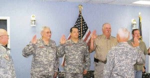 Lt. Colonel Alex Balkcum administers an oath to new members of the ASDF in Troy with Cpt. Bob McLendon (left) and Col. Warner J. May (right) in attendance. New members from left are Dennis Griffith, David Harriman, Don Smith, Tommy Woodard and Elaine McLeod. 