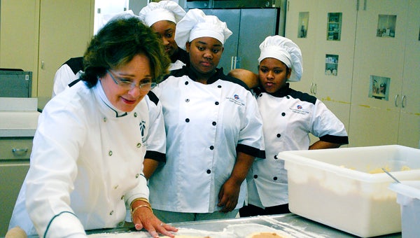 Patricia “Sister” Schubert visited culinary arts students at Charles Henderson High School on April 18 to teach them about entrepreneurship and how to make her famous cinnamon rolls. 