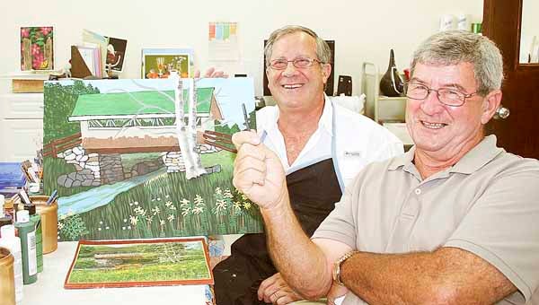 Circumstances have brought friends, Elmer Fleming and Donnie Mobley, together at a place neither thought they would ever be … a painting class. Fleming, left, has 13 paintings to his credit. Mobley’s just learning to handle the sketching chalk.