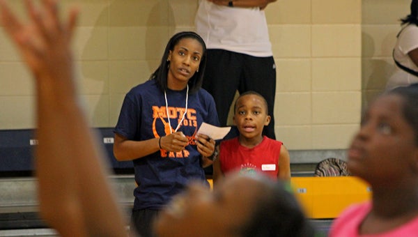 Erica Henderson keeps an eye on her group during the free basketball camp on Friday. (Photo/Ryan McCollough)