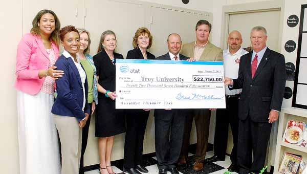AT&T presented Troy University with $22,750 in Aspire program funds Wednesday to pay for an after school tutoring program for freshmen and sophomores at Charles Henderson High School. 