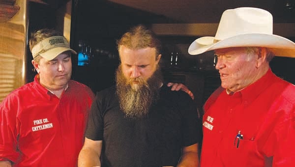 Jamey Johnson received a proclamation from Pike County Judge Wes Allen designating Aug. 24, 2013 as Jamey Johnson Day in Pike County. Pictured are Chris Chandler, Jamey Johnson and Ed Whatley.