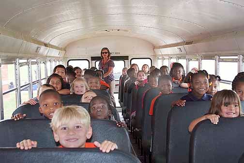 Kindergarten students see what it’s like on board a school bus.
