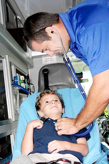 CARE Paramedic Richard Byrd checks John Gunter Senn’s vitals.