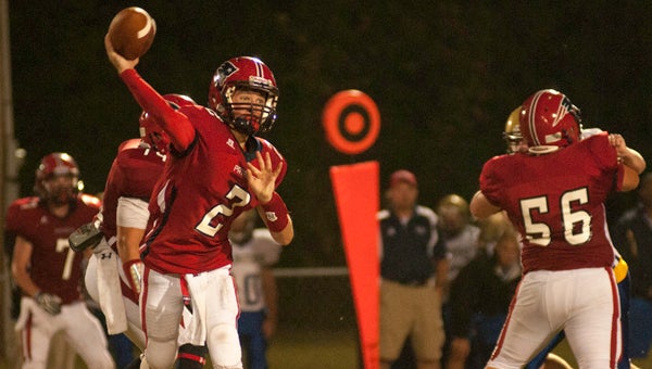 Pike Liberal quarterback Rush Hixon releases a pass during Friday night’s 60-0 win over Lyman Ward. 