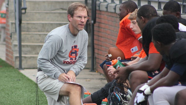 CHHS head coach Mike Dean goes over schemes with his starting defense at practice on Monday. (Photo/Ryan McCollough)