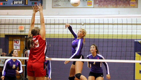Goshen’s Katie Thomas sends a kill over the outstretched arms of a Luverne blocker. (Photo/Ryan McCollough)