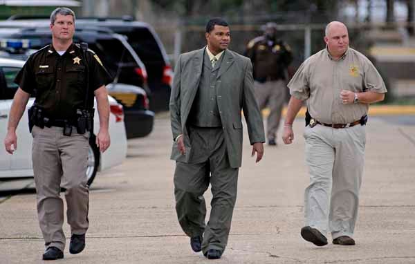 Andre Ellis, center, walks to the Pike County Jail from the Pike County Courthouse after the morning session of his trial in Troy, Ala., Monday, Jan. 14, 2013. Ellis is accused of raping two women on March 26, 2012. (Photo/Thomas Graning)