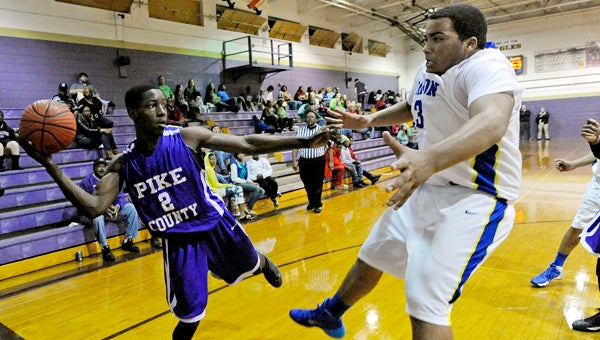 Pike County's Jerrell Lawson (2) looks to pass past Samson's Matt Stacy during a game in the Goshen Christmas Tournament in Goshen, Ala., Thursday, Dec. 19, 2013. (Photo/Thomas Graning)