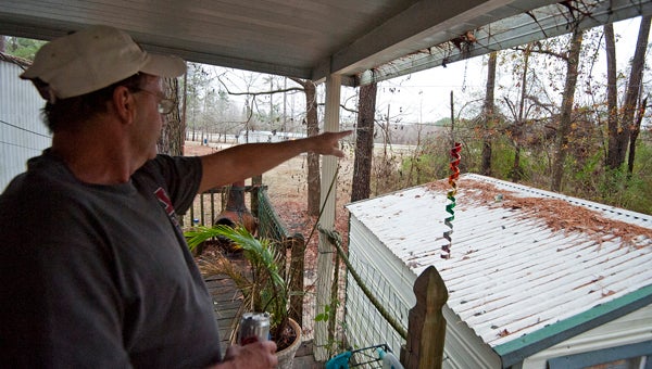 Rick Bernhard discusses the area that was damaged by a tornado during an interview at his home in Brantley Mobile Home Park in Troy, Ala., Monday, Dec. 23, 2013. Bernhard's mobile home was spared major damage in the Christmas tornado last year. (Photo/Thomas Graning)