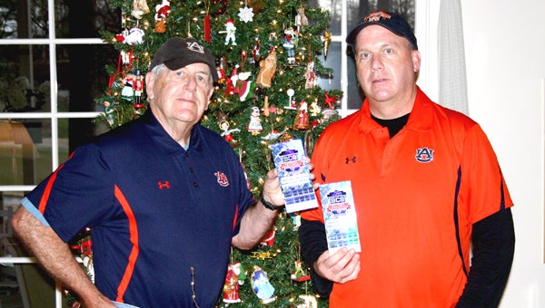 Roy (left) and Mike (right) LeCroy show off their BCS National Championship Game tickets.