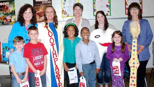 Dr. Regina Hendrix and her dental staff visited Banks Primary School Friday and shared with the students the importance of the proper care of their teeth and eating healthy. Pictured, with Hendrix are staff members, Janet Green, Cheri Register, Sarah Sullivan and Connie Morrow and students, Russ Fischer, Cody Roten, Deaisha Collins, Jazarian Rumlin and Aurora Stagner.