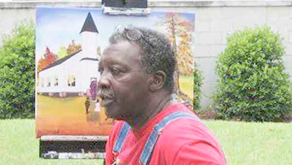 Artist Maurice Cook, whose works will be on display during this weekend’s TroyFest, says he doesn’t try to define his style, but welcomes the label of ‘folk artist.’ The artist says he simply ‘paints from the heart.’ TroyFest will be Saturday and Sunday in downtown Troy on the Square.