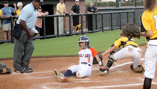 Kelcie Gibson slides in safe at home to score the winning run for Charles Henderson on Friday. (Photo/Ryan McCollough)