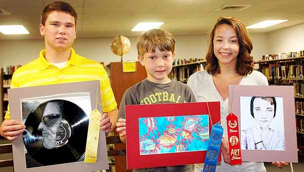 From left, PLAS students C.J. Allen, Cody Law and Rachel Riley placed in a state art competition.  