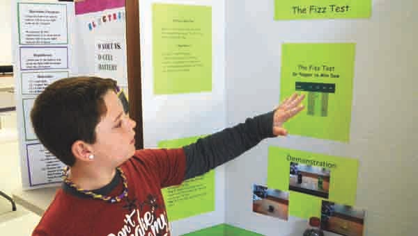 Sean Buchanan examined the differences in the fizzes of his favorite soft drinks for his science fair project. The Goshen fourth-grader presented his project with his peers on Tuesday. The fair continues through Thursday, with fifth- and sixth-graders sharing their projects today and Thursday. Messenger Photo/Mona Moore