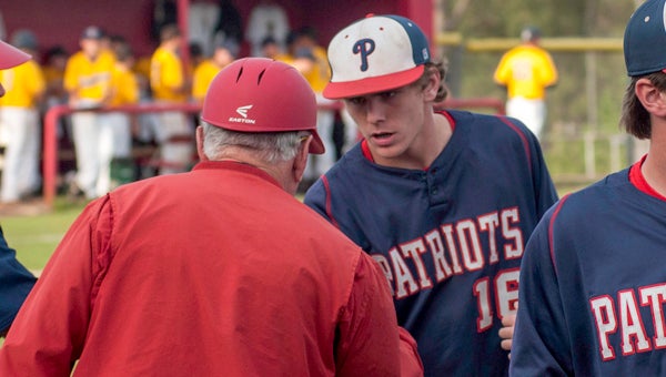  Connor Vowell (16) gets a handshake from head coach Butch Austin and assistant Alex Adams after Vowell threw a complete game to earn the win in game one. (Photo/Joey Meredith)