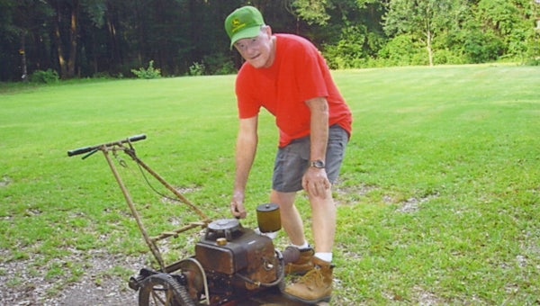 Windley Wade Tatom stands next to his 1964 Carter Brothers E-Z Mow lawn mower. (Submitted Photo)