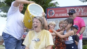 First grade teacher Heather Bunn joined several of her Troy peers after she accepted the ALS Ice Bucket Challenge Saturday afternoon.  Messenger Photo/Scottie Brown
