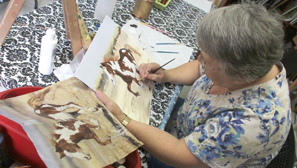 Messenger Photos / April Garon The Colley Senior Center offers seniors many classes in the arts, fitness, dancing, geneology and other topics. Seniors focus on painting projects Friday August 1 at the morning painting class taught by  Mary Page. Above, Faye Wright works on a painting of a horse for her grandson. Below right, Linda Evans works on a portrait of Roy Rodgers. She chose him as a subject because she grew up watching him and say he is her hero. 