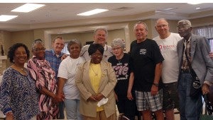 Troy University head football coach Larry Blakeney was the special guest at the Troy Nutrition Center Tuesday. Blakeney talked football with the seniors and stayed around for lunch and a photo opportunity with a few Trojan fans. Pictured with Blakeney, from left, Hassie Green, Center director, Millie Baker, Tom Gower, Mary Daniels, Eva Collins, Alice Henderson, Raymond Wheeler, Lamar Lowery and Charlie Terry. (Messenger photo/Jaine Treadwell)