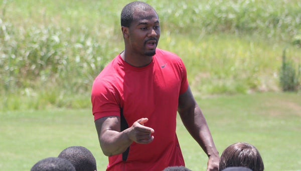 Former Charles Henderson, Auburn and Oakland Raider defensive back Zac Etheridge speaks to members of the Charles Henderson football team last month at the Wiregrass 7-on-7 Championship. (Photo/Ryan McCollough)