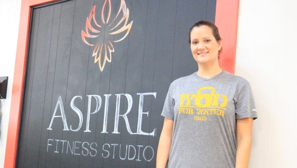 Messenger photo/ April garon Amanda Hardin, Aspire Fitness Studio’s owner, opened the fitness facility  on the Square in downtown Troy recently. Hardin has been in the field since 2009. The business offers high intensity interval training classes, personal training, stretch classes, nutrition program and massage therapy. 