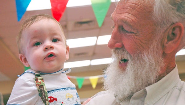 Tipp Boutwell and Kenneth Smith share a moment together during First United Methodist Church’s Grandparents Day on Friday. Troy Public Library's Children's Librarian was the guest speaker at the event.  (MESSENGER PHOTOS/ JAINE TREADWELL)