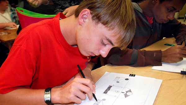 Messenger photo/Jaine Treadwell Caleb Green had the opportunity to attend two ArtBridges classes offered to math and science students at Pike County High School by the Johnson Center for the Arts Monday. Green learned that art plays a large part in the design of buildings.