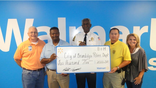 Submitted Photo The Walmart Foundation recently donated $2,500 to the Brundidge Police Department. Pictured from left are Walmart DC General Manager Robert Chappell, Sergeant Charles Beasley, Police Chief Moses Davenport, Investigator David Hierschey and Human Resources Manager Michelle Grantham.