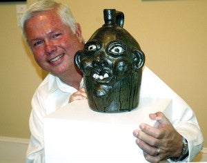 Messenger Photo/Jaine Treadwell Dr. Robert Gilliam shared info about his face jug collection. 