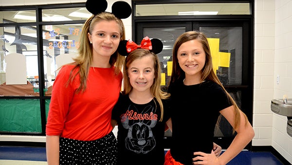 Messenger photos/Scottie Brown Charles Henderson Middle School students dressed up as Disney characters this week as part of their homecoming celebrations. At top Kate Deal, Audrey Law and Allison Dubose dressed as Minnie Mouse;  Reagan Gross, Tamiya Green, Whittaka Starks and Laura Ashley Witherington all dressed as their favorite Disney characters; Emma Kirkpatrick and Hannah Calhoun dressed as two of The Incredibles while Danny Truong dressed as Woody from Toy Story; and at right,Ariel Barron, Nicole Barron and Lendon Adamson all dressed like characters from Disney’s Frozen
