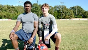 Jeremy James, left, and Rush Hixon, right, pose after the team’s practice on Thursday. MESSENGER PHOTO/SCOTTIE BROWN
