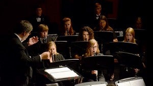 The Troy University Symphony Band held a free concert Tuesday. Conductor Mark J. Walker, directs the band during one of Tuesday’s pieces.   MESSENGER PHOTO/SCOTTIE BROWN