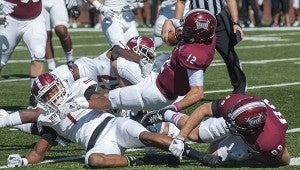 Troy QB Brandon Silvers crosses the goal line to score the Trojans' first touchdown for the afternoon as they beat New Mexico State during Homecoming, 41-24 Saturday afternoon for their first win of the season.  MESSENGER PHOTO/JOEY MEREDITH