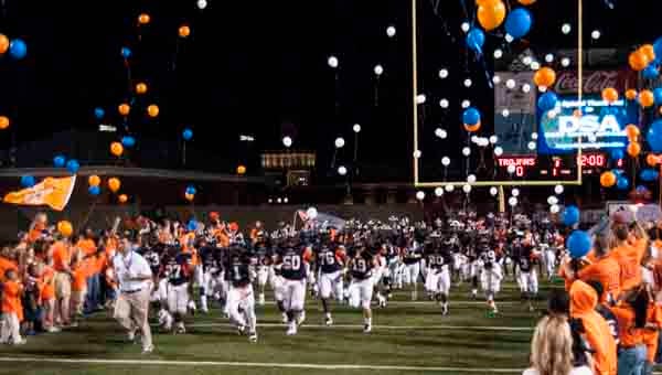 Charles Henderson players and fans released balloons as the Trojans ran onto the field Friday night during the Trojan's game with the Sidney Lanier Poets. The balloons are in memory of DeMario Harris, a senior player who died earlier this week after collapsing during last Friday night's game. (Messenger Photo/Joey Meredith)