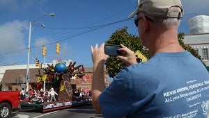 Roy Jenkins takes a picture of Chi Omega’s float during Saturday’s Homecoming parade. MESSENGER PHOTO/SCOTTIE BROWN