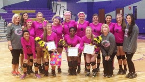 The Goshen varsity volleyball team poses before their game against Ariton on senior night. The team wore special pink jerseys to honor former coach Dee Hughes who passed away last September from breast cancer. MESSENGER PHOTO/SEAN HOLOHAN