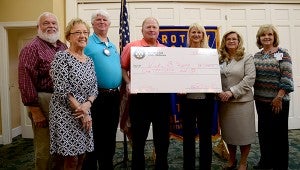 Troy Rotary Club and Pike Medical Foundation presented a check to the winner of the 2014 Balloon Launch today during the Rotary meeting. Pictured are: PMF members Jim Roling and Mary Williams; Troy Rotary President Keith Roling; PMF treasurer Herby Haisten; Vickie Sipper, winner of the $1,000 award; TRMC Chief Executive Officer Teresa Grimes; PMF member and TRMC Marketing Director Karen Herring. The event was a combined effort of the Troy Rotary Club and Pike Medical Foundation and raised over $24,000 with the event.  MESSENGER PHOTO/SCOTTIE BROWN 