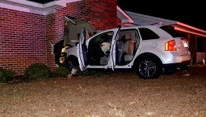 MESSENGER PHOTO/SCOTTIE BROWN Friday at approximately 6 p.m. local authorities responded to a motor vehicle accident that involved a house and an SUV. The SUV, seen here, reportedly ran a stop sign and through a light pole before crashing through the residence on Co. Rd. 5513.  MESSENGER PHOTO/SCOTTIE BROWN