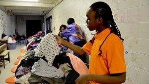 Nevaeh Howard looks through the donated clothes at Christian Love Community Center on its Day of Giving last Friday. The event was organized by the center to give back to the community with a focus to inspire, encourage and make a difference for the citizens of Pike County.